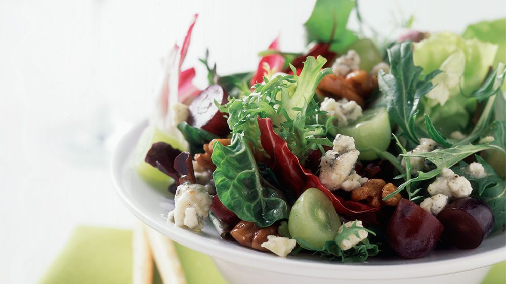 baby-greens-with-grapes-hot-sweet-pecans-and-gorgonzola