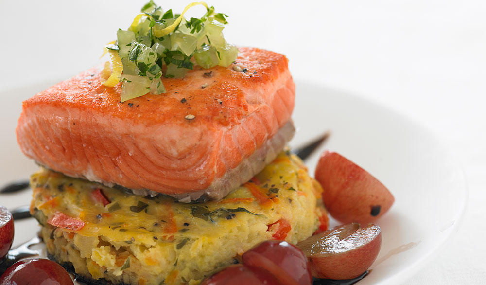 salmon on polenta with sliced grapes