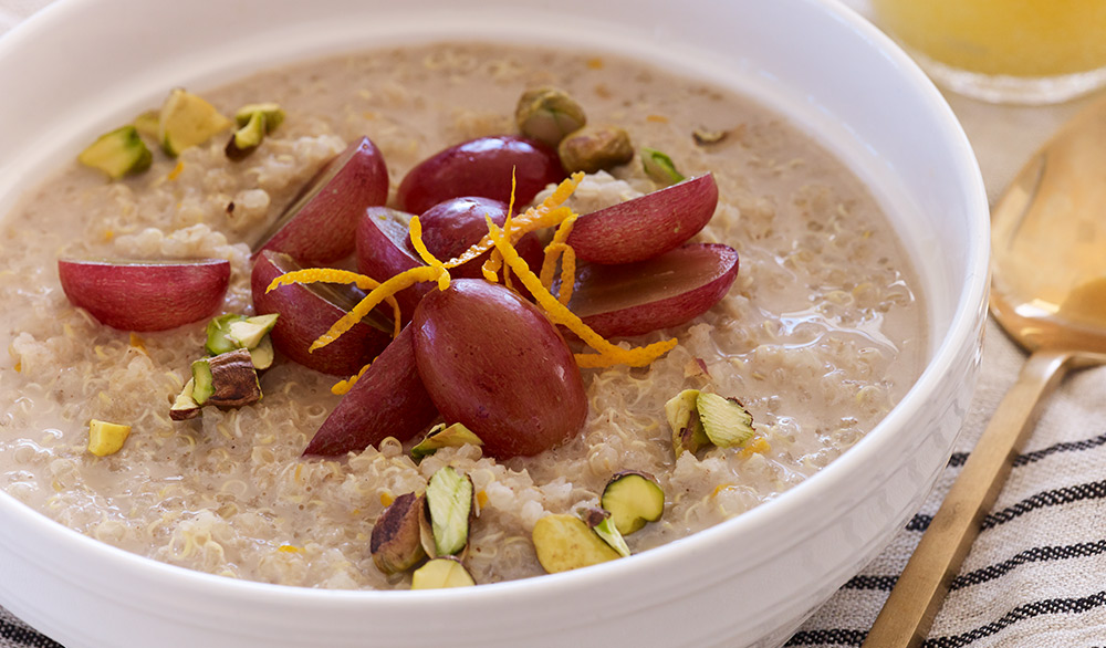 quinoa breakfast cereal with grapes and pistachios